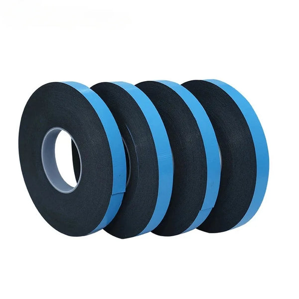 Rolls of black and blue heavy duty double-sided mounting tape stacked together