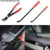 A set of three red and black clips removal tools for car trim, shown in close-up against a dark automotive surface.