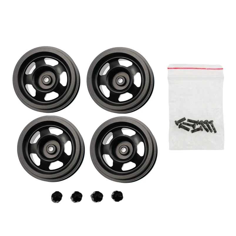 A set of four black metal rims and several small black screws for an RC car upgrade.