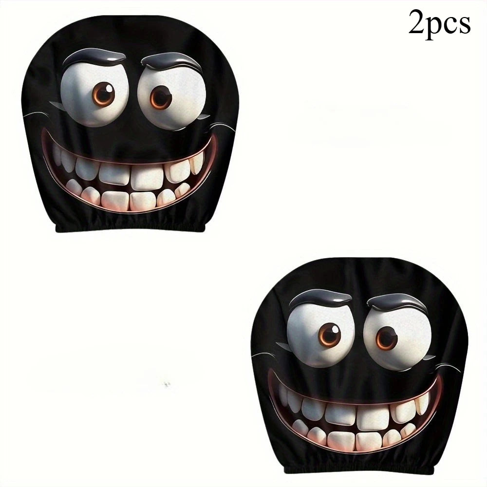 A pair of black smiley face car headrest cushion covers featuring wide eyes and a large toothy grin.