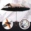 A folding umbrella designed like a katana, featuring a dark canopy and decorative elements.