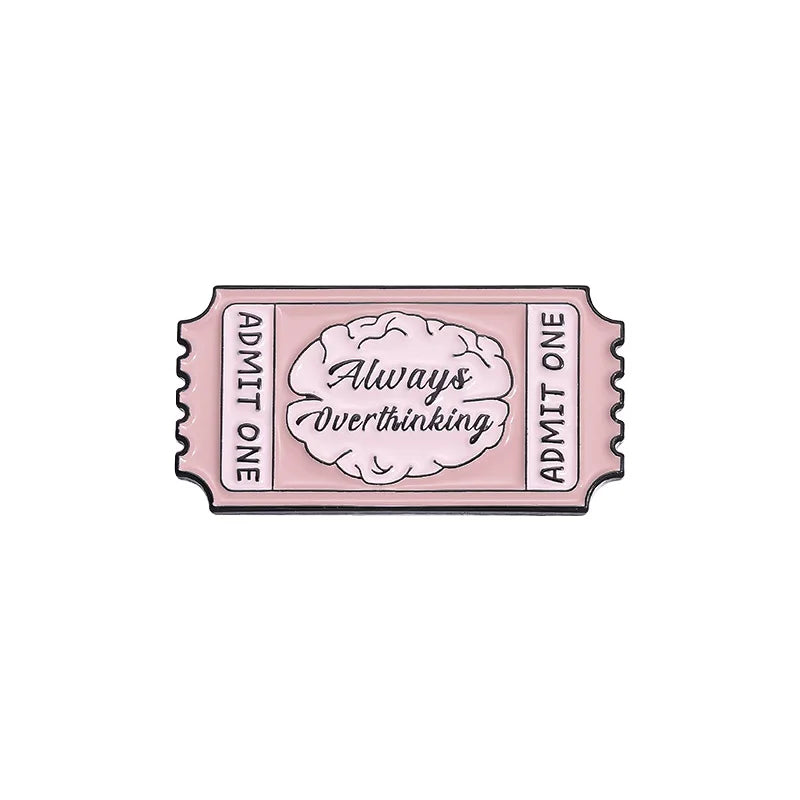 A vintage airline ticket enamel brooch set with pink enamel and text reading Always Overthinking
