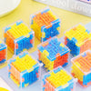 A collection of colorful, transparent 3D maze cubes made of plastic blocks.