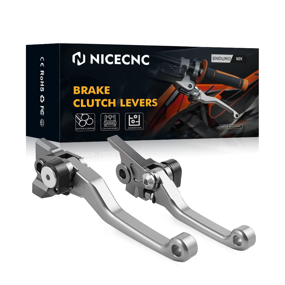 A set of CNC aluminum brake and clutch levers for dirt bikes displayed on a black product box.