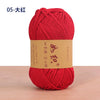 A red ball of cotton blend crochet yarn labeled 05-大红.