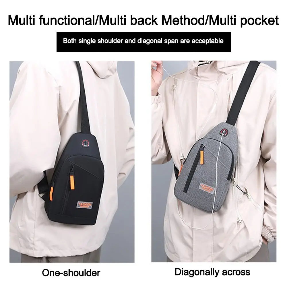 A black and gray multi functional bag shown being worn on one shoulder and diagonally across a light colored jacket.