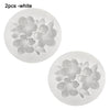 Two white silicone floral molds for crafting candles, soap, resin, and plaster