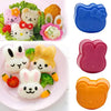 A set of pink and orange rice ball moulds for DIY bento making featuring various cute animal shapes.