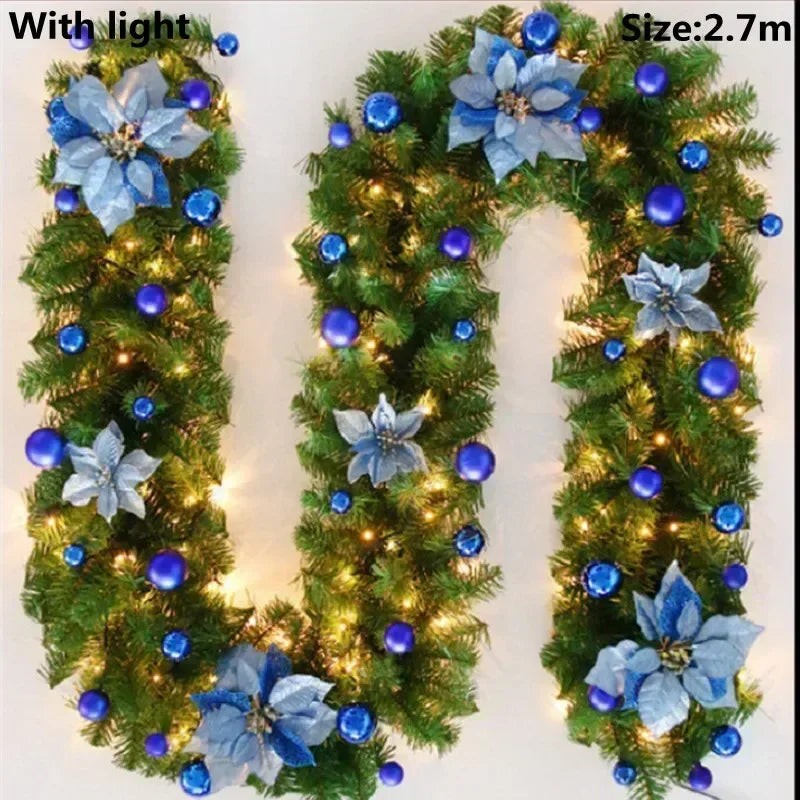A green LED rattan Christmas garland with blue flowers and blue ornaments, measuring 2.7 meters long.