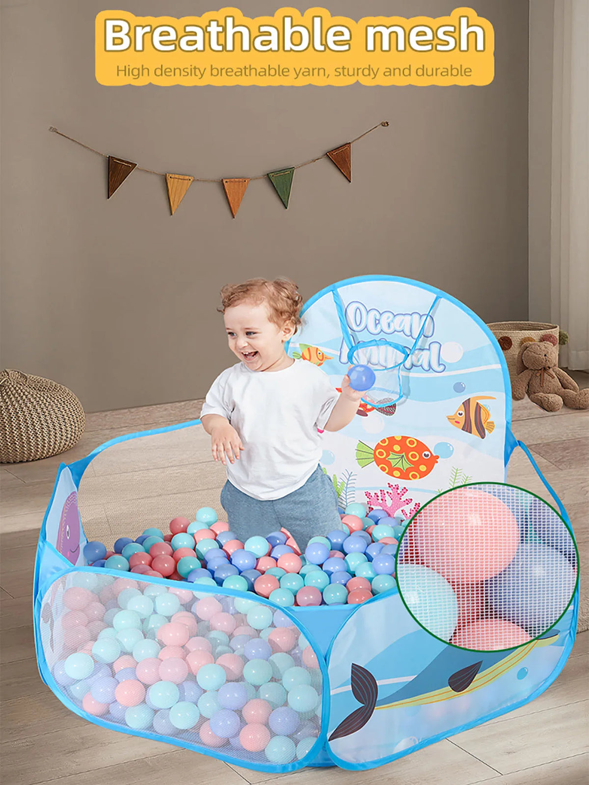 A blue ball pit with a basketball hoop and various colored balls is shown for children's play.