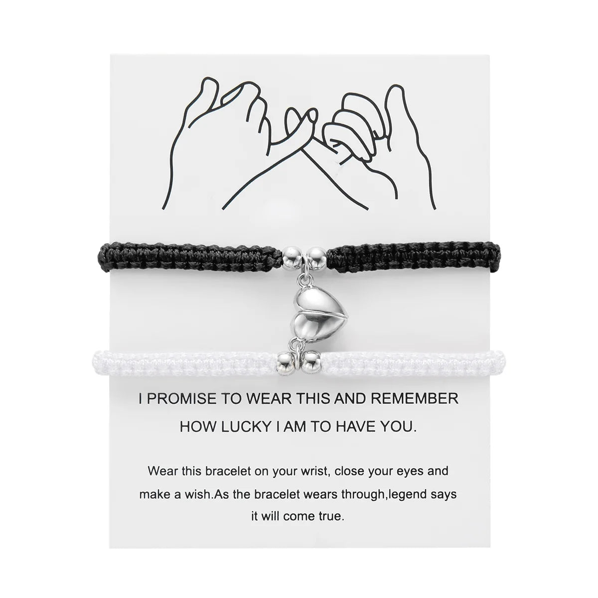 A pair of black and white magnetic heart couple bracelets with a promise message