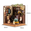 A detailed wooden dollhouse miniature assembly kit featuring various figures and elements with LED lighting.
