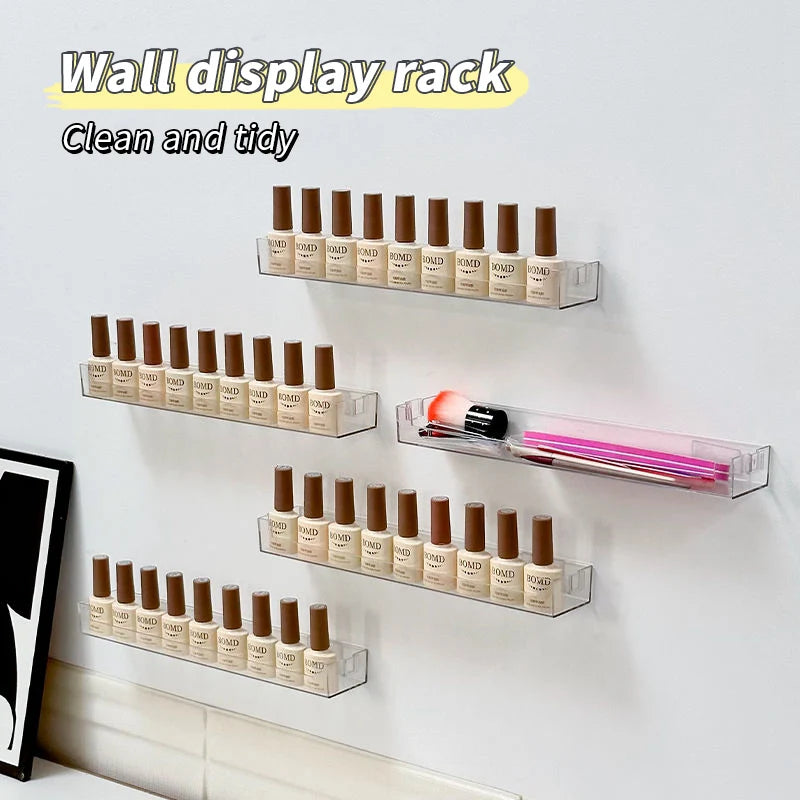 A wall display rack featuring multiple rows of clear acrylic bottles and tubes for organizing cosmetics or similar products.