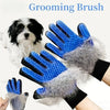 A blue grooming brush is shown being used on a dog's fur.