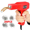 A hand holds a red plastic welding gun with a gold tip, next to several packs of metal wire.