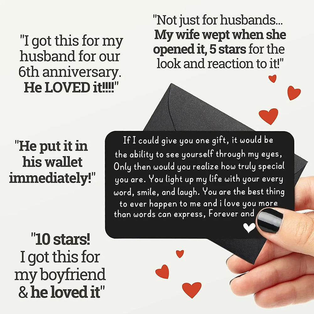 A hand holds a black card with handwritten messages about gifts and love notes.