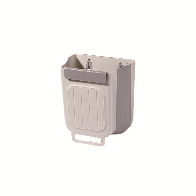 A light gray foldable hanging trash bin designed for kitchen and home use.