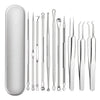 A collection of stainless steel acne and blackhead removal tools displayed against a white background.