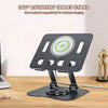 A black 360° rotating tablet stand is shown on a wooden desk, designed for wireless charging.