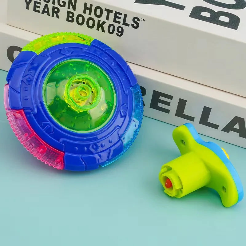 A bright blue and green glowing musical spinning top is shown next to a yellow and blue plastic toy.