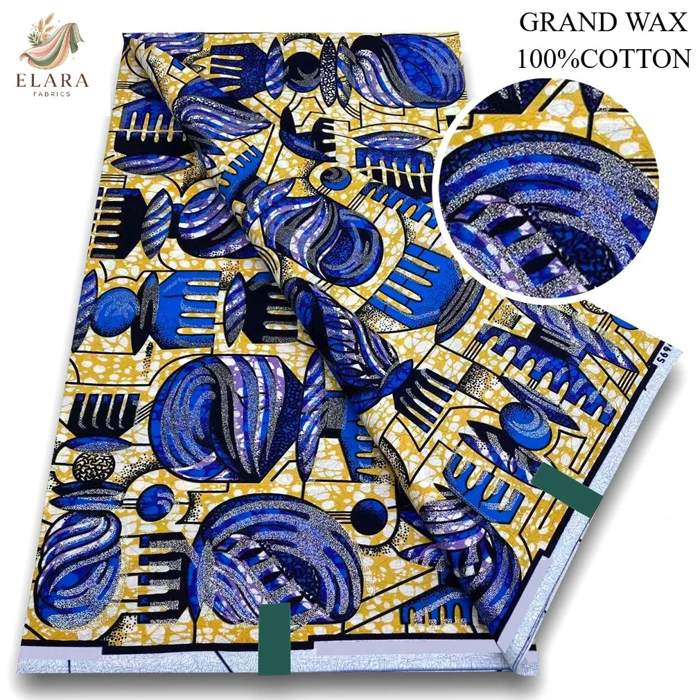 A bolt of blue and yellow African wax print fabric featuring intricate patterns and glitter texture.