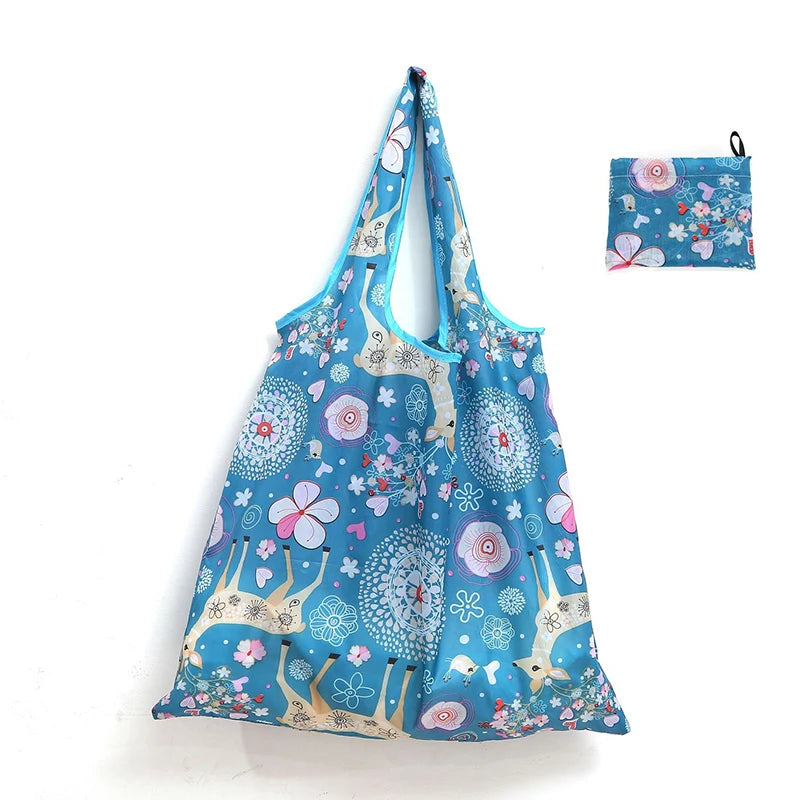 A blue floral reusable shopping tote bag with a matching fabric carry pouch.