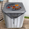 A gray outdoor AC unit cover with a breathable mesh top displaying autumn leaves.