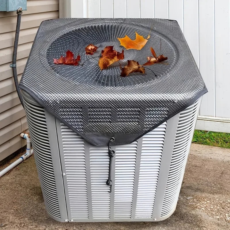 A gray outdoor AC unit cover with a breathable mesh top displaying autumn leaves.