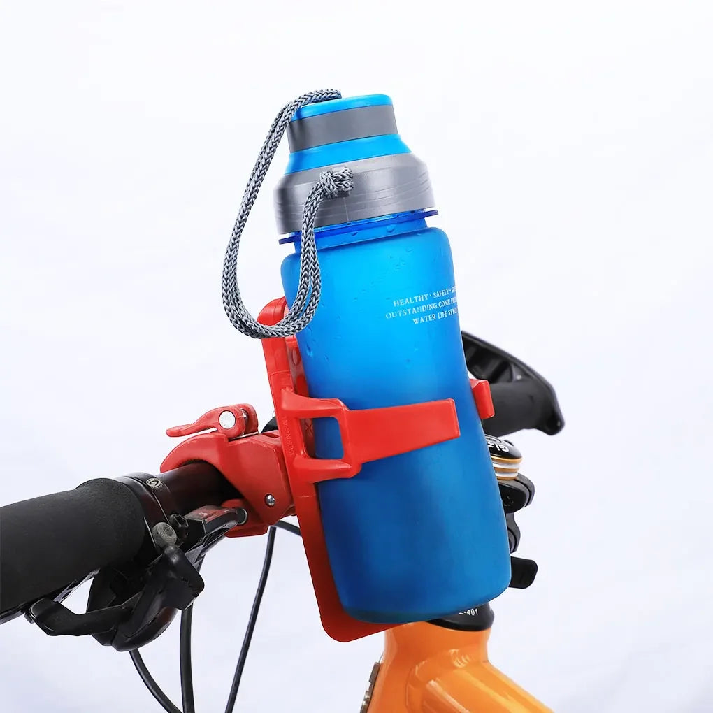 A blue water bottle is secured in a red bicycle water bottle cage mounted on a bike frame.