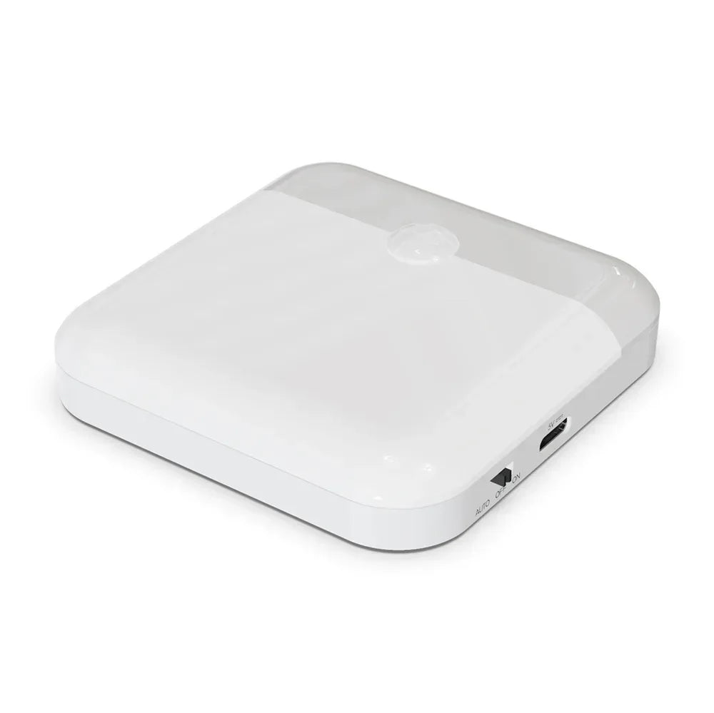 A white rechargeable motion sensor night light device viewed from above.