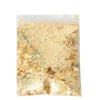 A sheet of metallic gold foil flakes for crafting, nail art, and resin projects.
