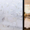 Close-up of frosted stripe privacy window film with elegant swirling patterns.