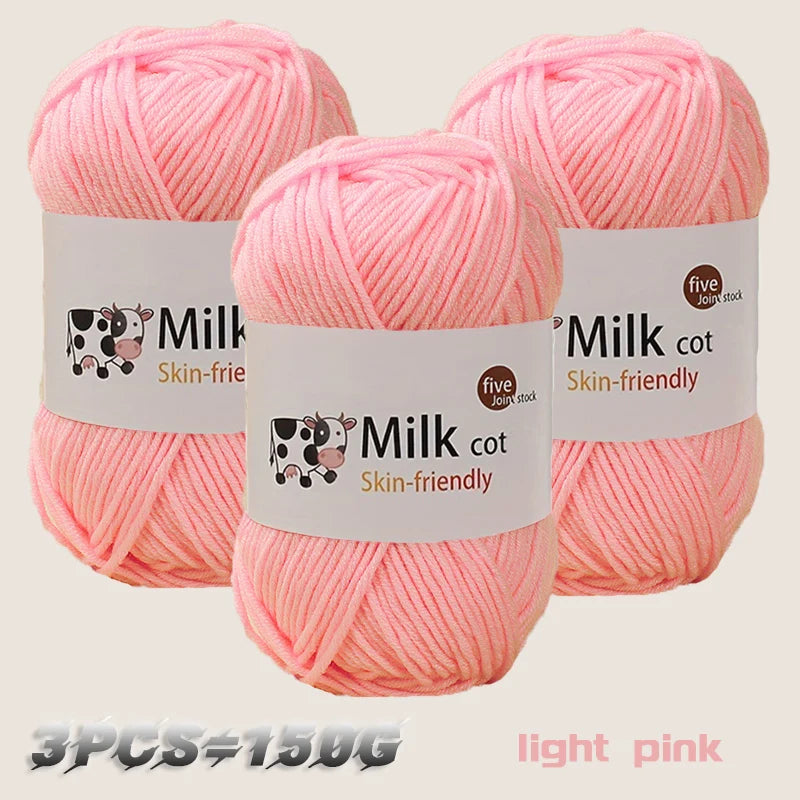 Three skeins of light pink Milk cot yarn are displayed, showing the texture and packaging.