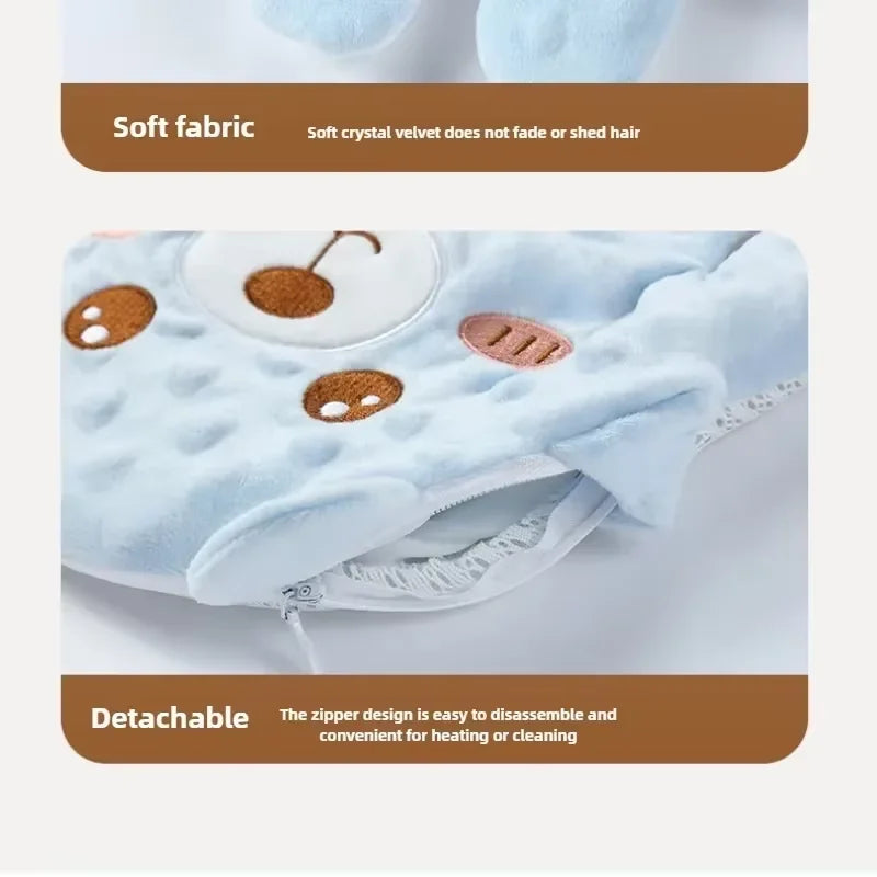 Light blue fabric baby sleep pillow with palm-shaped appliqués and a detachable zipper design