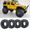 Yellow RC vehicle with rubber mud terrain tires and accessories.
