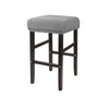 A gray bar stool slipcover made of stretchy jacquard fabric with an elastic edge.