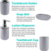 A set of four bathroom accessories including a toothbrush holder, soap dish, lotion dispenser, and toothbrush cup, all in whi