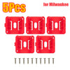 Five red plastic wall-mount battery holders with metal screws for Milwaukee power tool batteries