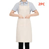 A person is wearing a light beige apron over a gray t-shirt, with a second matching apron visible.