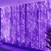 Purple LED curtain string lights with fairy lights illuminating a window or backdrop.
