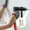 A hand using a power drill to install heavy duty self-drilling drywall anchors into a wall.