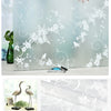 A sheet of frosted privacy window film featuring a white floral and swirling vine pattern.