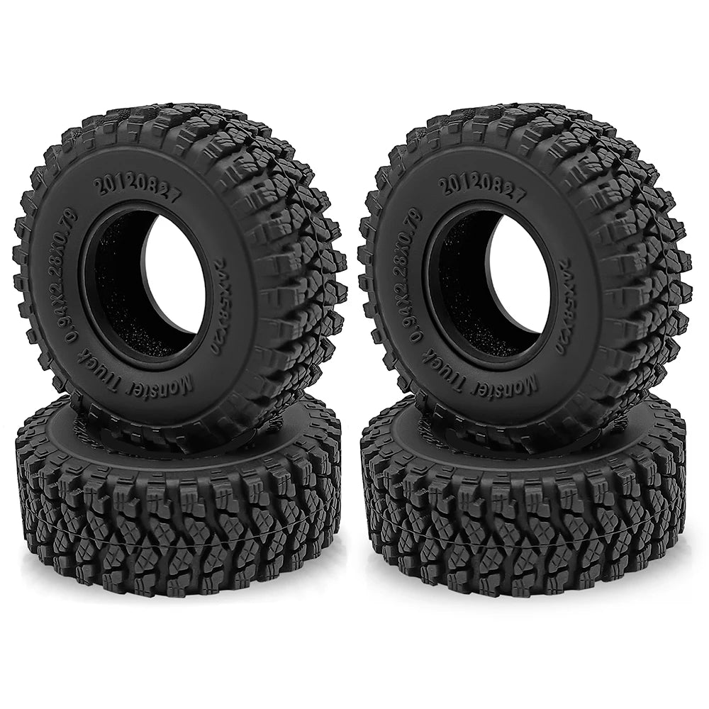 A pair of black rubber mud terrain tires for Axial SCX24 and TRX4M