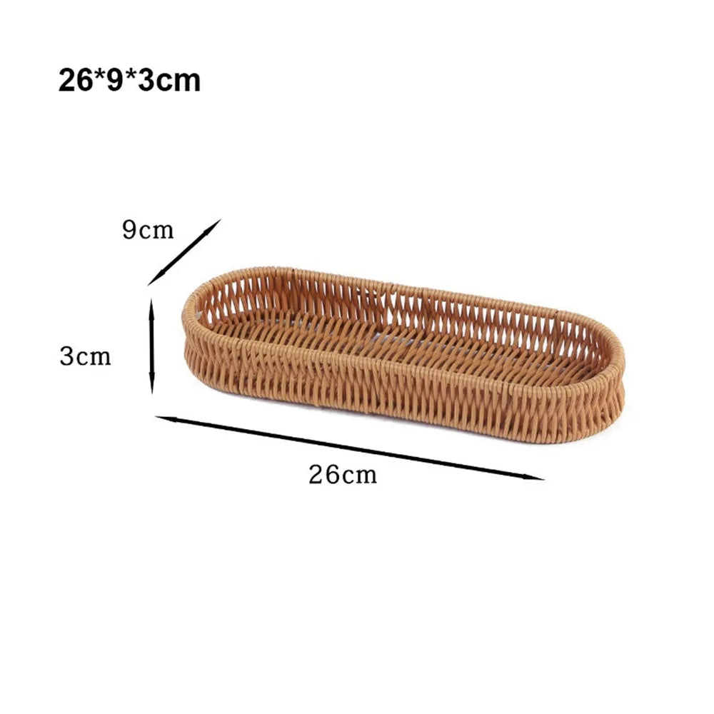 A rectangular handwoven wicker serving basket with dimensions 26x9x3 cm.