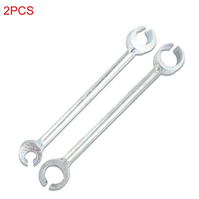 Two silver double-ended door hinge adjustment wrenches.