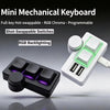 A white mini mechanical keyboard with RGB backlighting and a separate knob is shown on a gray background.