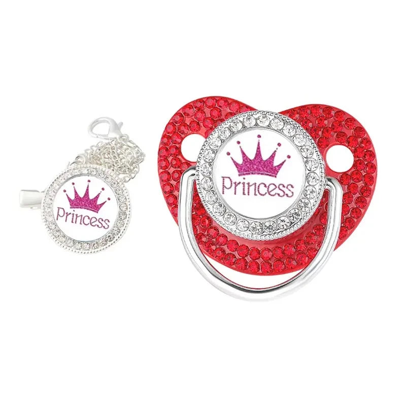 A set of crystal rhinestone pacifier chain clips featuring a red gemstone and a silver crown design.