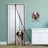 A magnetic door screen with a self-sealing mesh is shown in a light green room, featuring a cat sitting in front of the scree