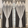 Gray blackout curtains with white trim and wave pattern hanging in a window frame.