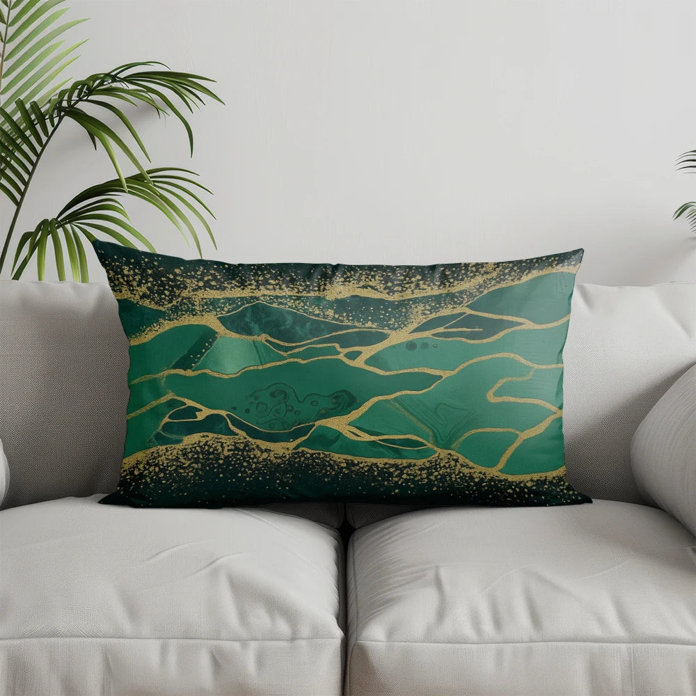 A decorative pillow featuring a teal background with abstract gold lines and speckles.